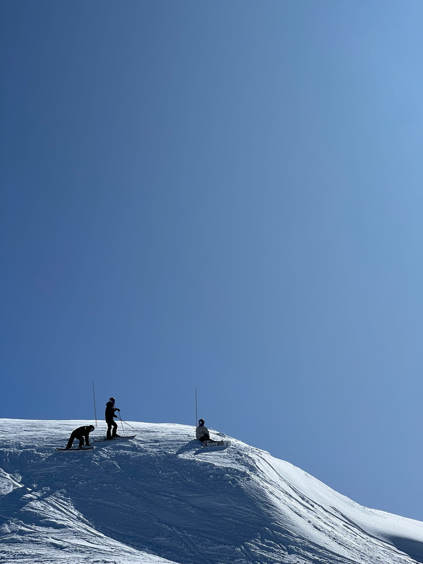 People at the top of Mouth Hotham in amazing snow on a Blue Bird Day