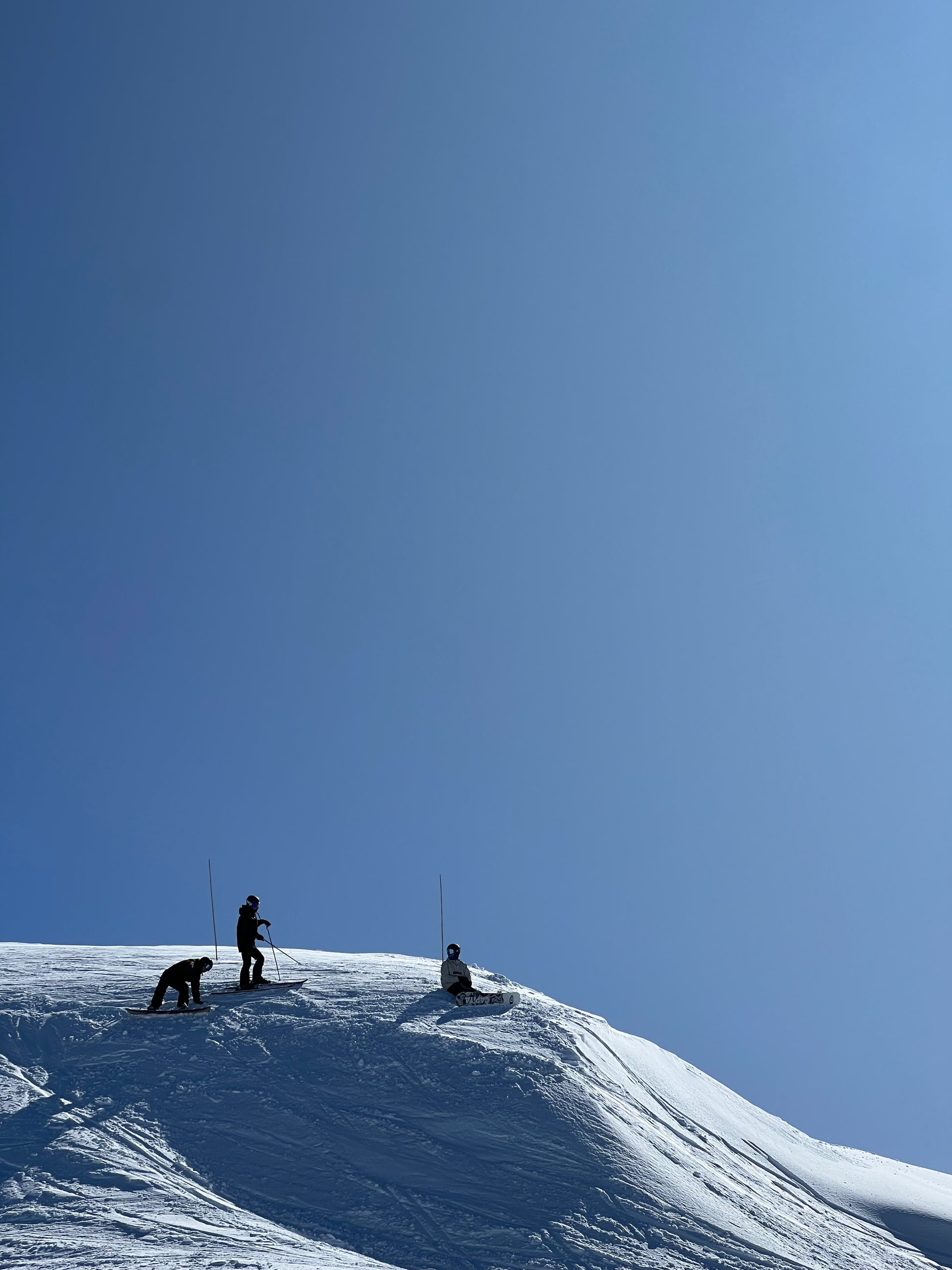 People at the top of Mouth Hotham in amazing snow on a Blue Bird Day